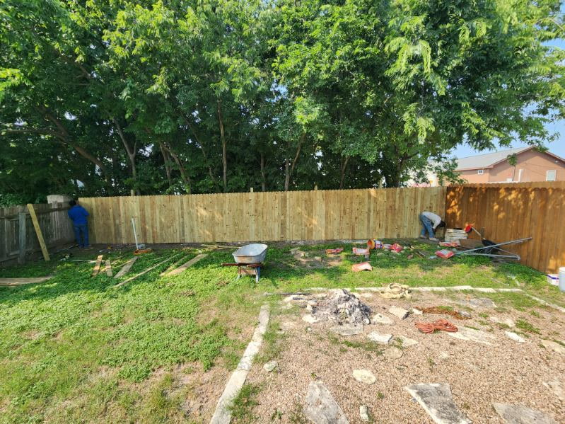 Green River crew mid-build on a long backyard privacy fence in Austin